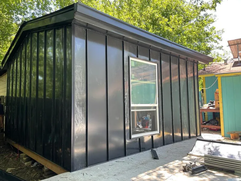 Black standing seam metal wall panels for Roof Inspection in Rosemount