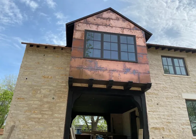 Copper metal panel facade on a stone building for Skylight Installation in Rosemount
